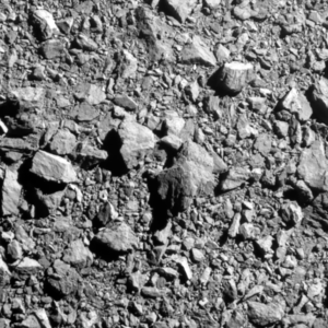 Poslední kompletní snímek asteroidu Dimorphos, jak jej viděla kosmická sonda NASA DART (Double Asteroid Redirection Test) dvě sekundy před dopadem. Snímač zachytil 30metrů širokou část asteroidu. NASA, APL